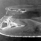 The Midway Atoll, looking westward. Eastern Island, with the airfield, is in the foreground, with Sand Island behind. (US Navy)